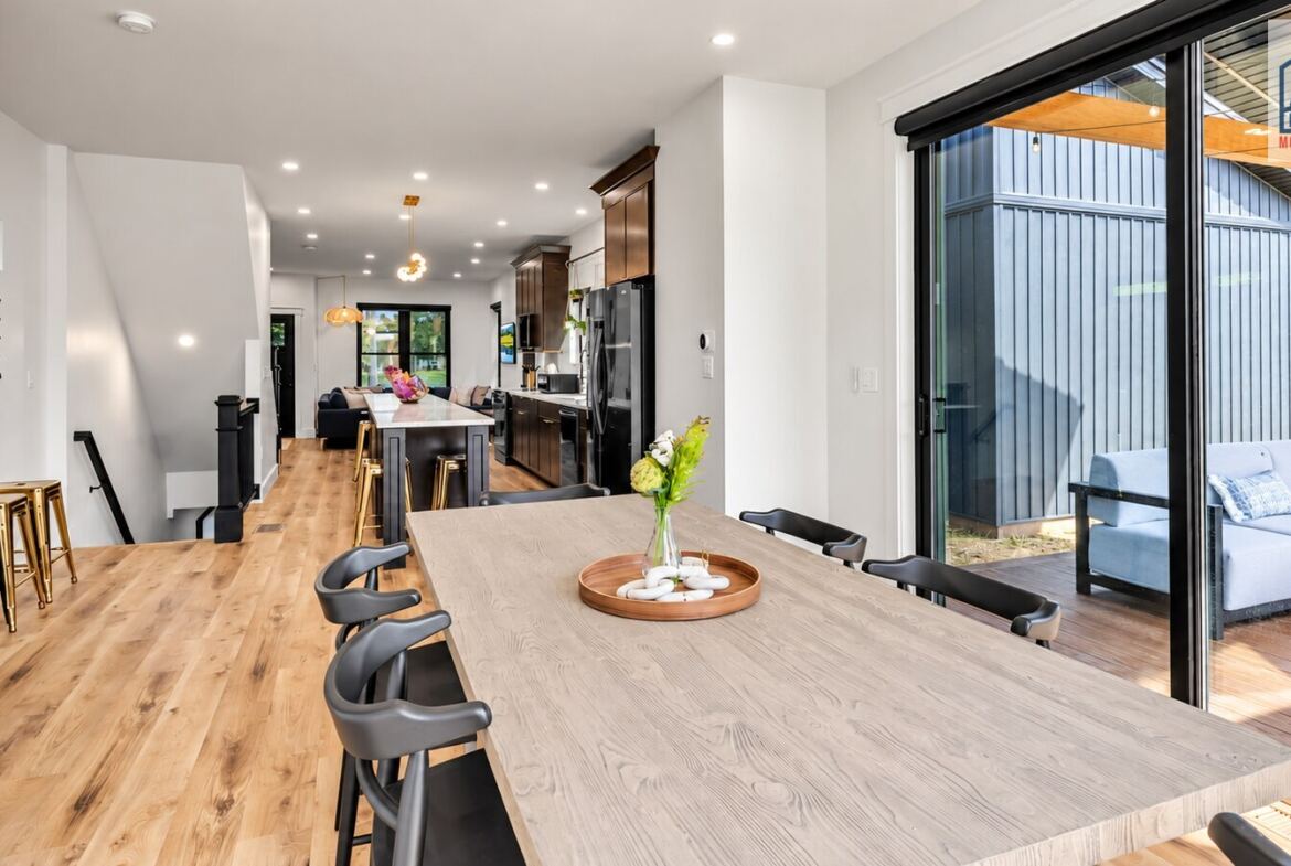 Cornerhouse open-plan kitchen and dining area with patio access