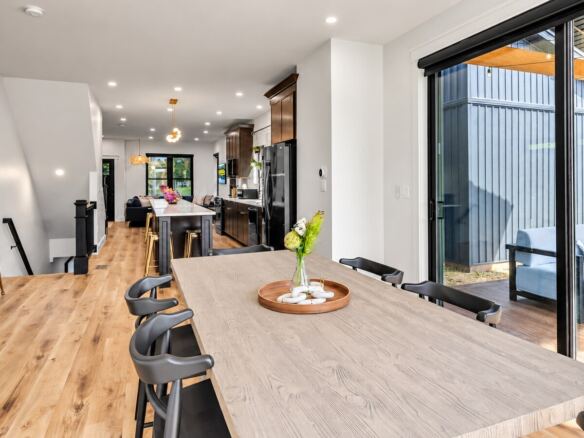 Cornerhouse open-plan kitchen and dining area with patio access