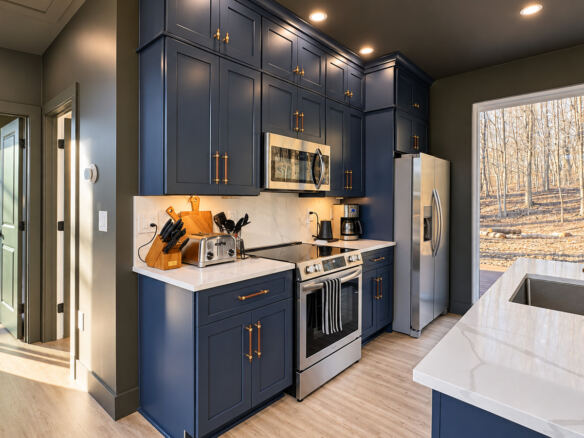 Modern Maples dark kitchen cabinets with quartz countertops